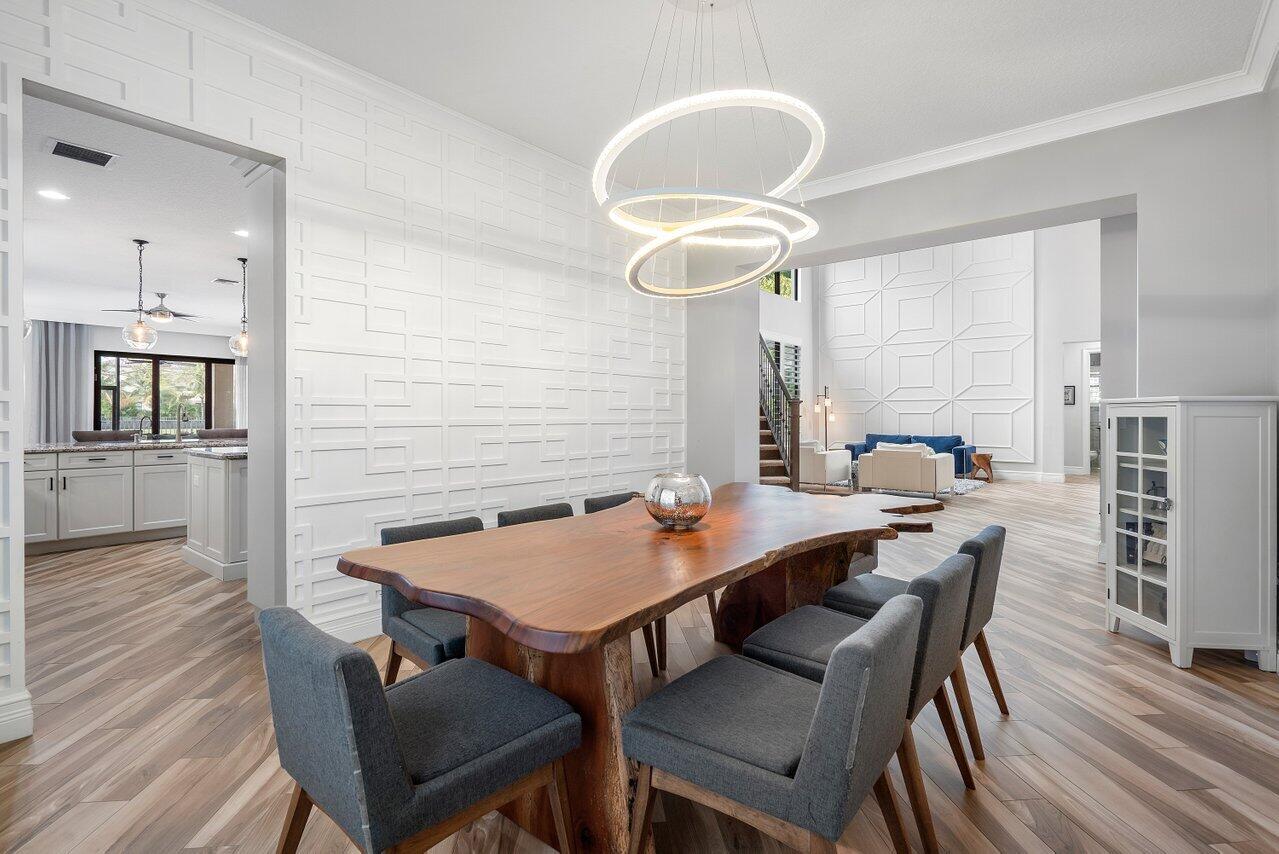 16857 Pierre Circle Delray Beach, FL 33446 - Photo 10 of 57 a view of a dining room with furniture and wooden floor