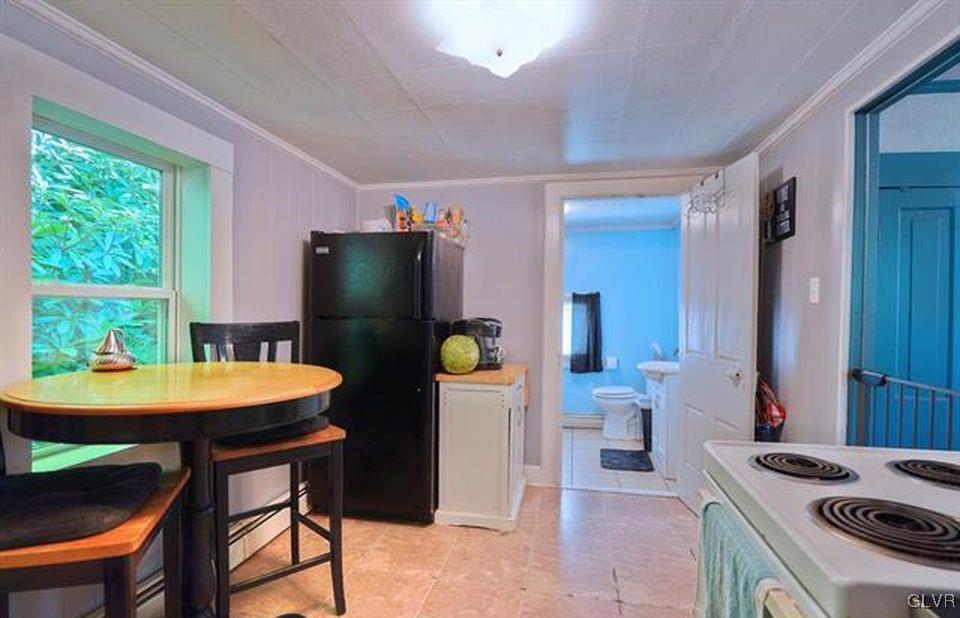 2205 Long Run Road Lehighton, PA 18235 - Photo 5 of 9 a kitchen with stainless steel appliances kitchen island a table and chairs in it