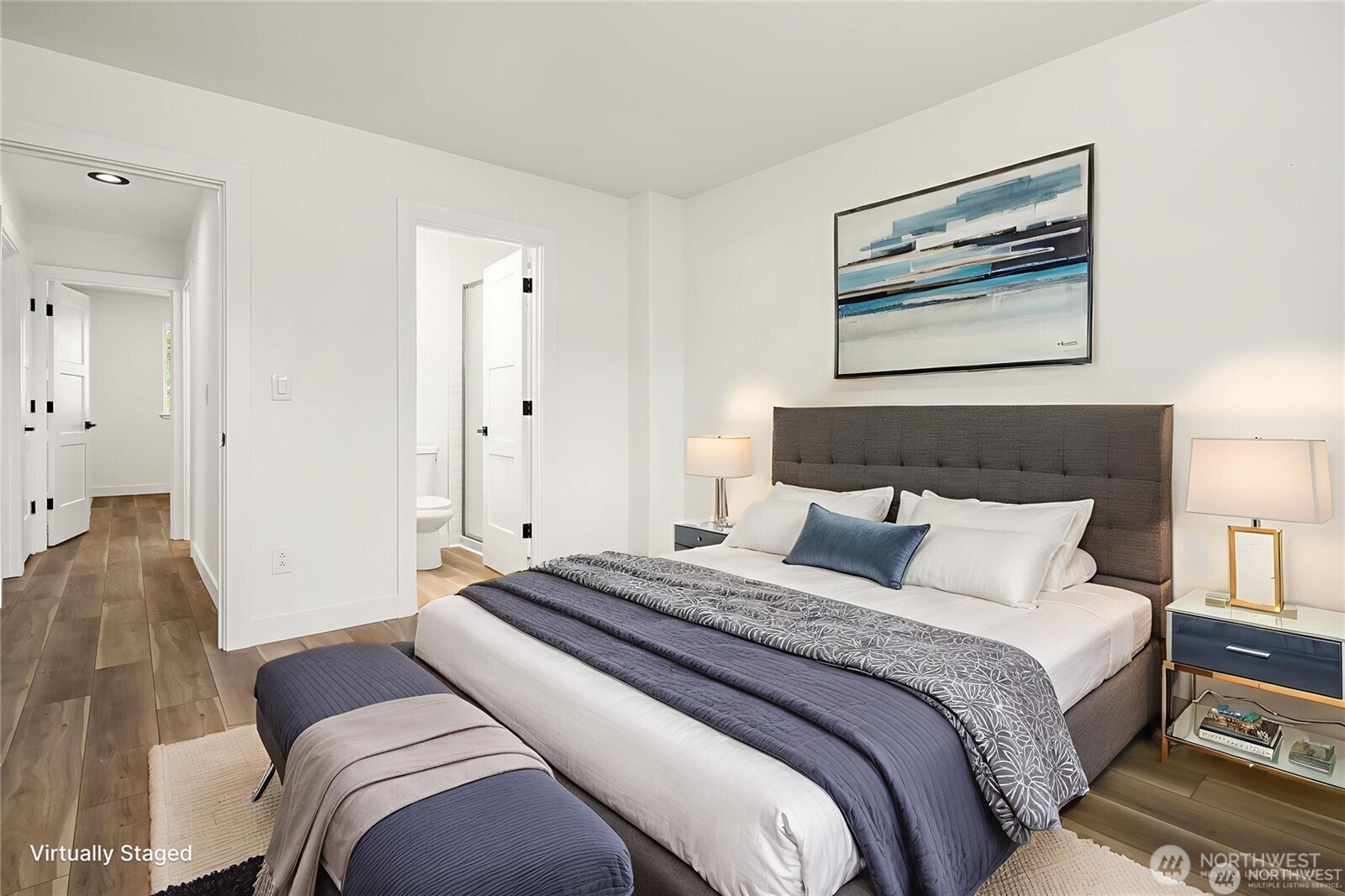 9 76th Street Southeast Everett, WA 98203 - Photo 16 of 28 a bedroom with a large bed and a painting on the wall