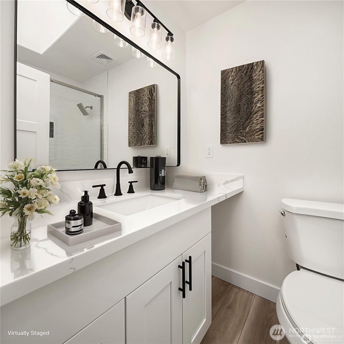 9 76th Street Southeast Everett, WA 98203 - Photo 25 of 28 a bathroom with a toilet a sink and mirror