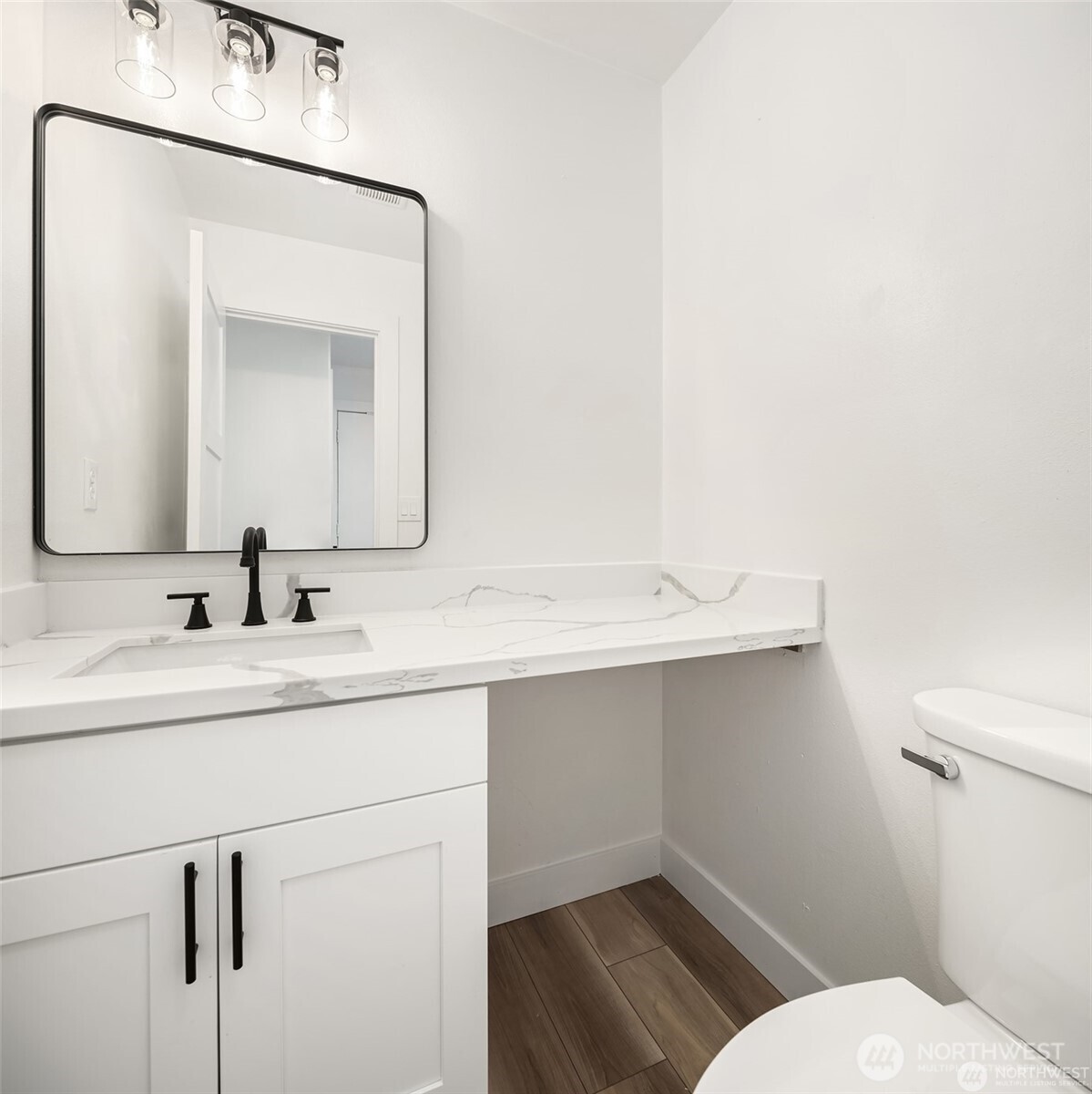 9 76th Street Southeast Everett, WA 98203 - Photo 27 of 28 a bathroom with a toilet sink and mirror