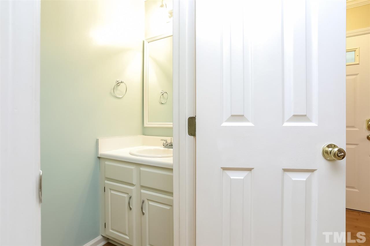 2357 Declaration Drive Raleigh, NC 27615 - Photo 14 of 24 a bathroom with a shower sink and mirror