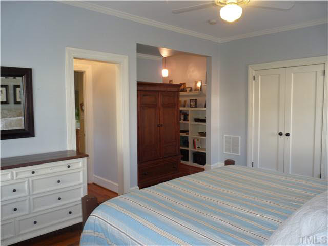 512 Chesterfield Road Raleigh, NC 27608 - Photo 15 of 25 a bedroom with a bed and a dresser