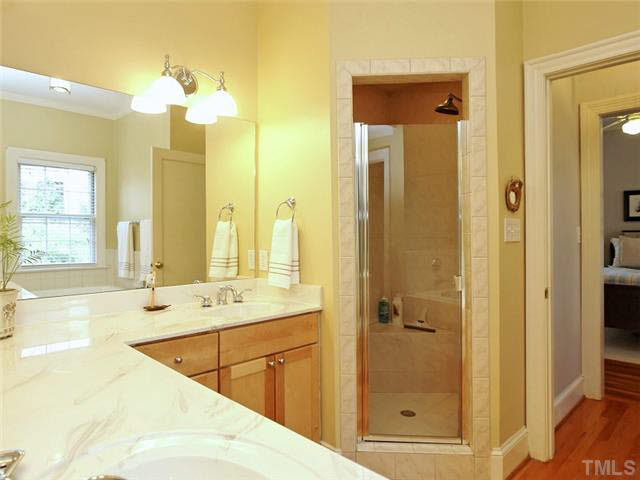 512 Chesterfield Road Raleigh, NC 27608 - Photo 17 of 25 a bathroom with a double vanity sink mirror and shower