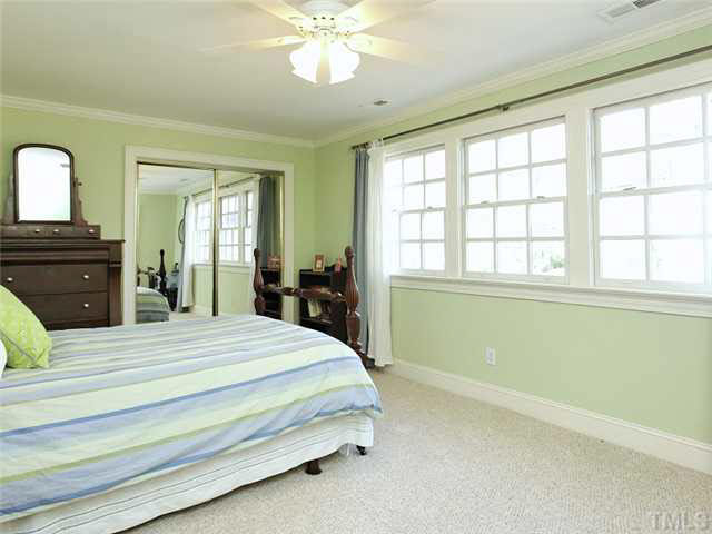 512 Chesterfield Road Raleigh, NC 27608 - Photo 19 of 25 a bedroom with a bed and a large window