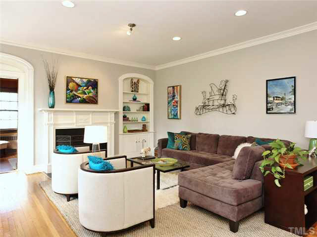 512 Chesterfield Road Raleigh, NC 27608 - Photo 2 of 25 a living room with furniture and a fireplace