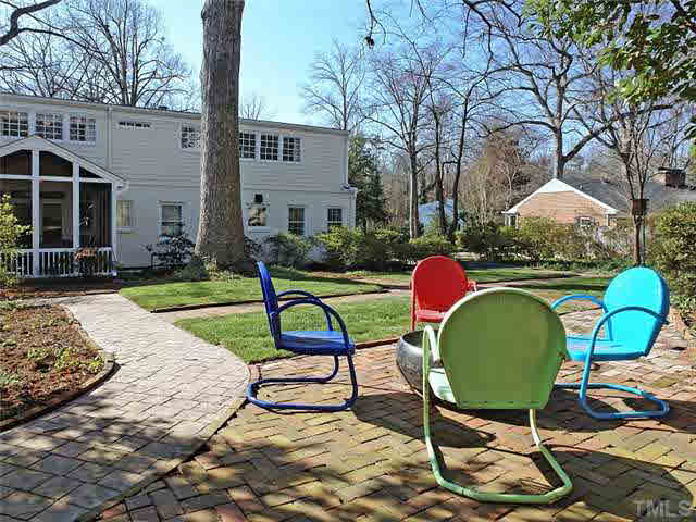 512 Chesterfield Road Raleigh, NC 27608 - Photo 24 of 25 a view of a backyard with furniture and a garden