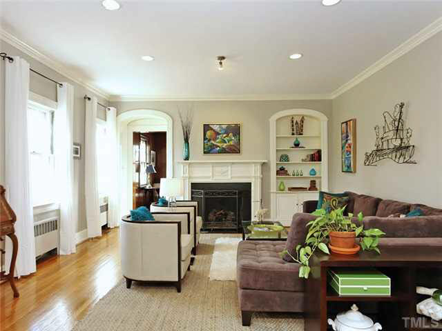 512 Chesterfield Road Raleigh, NC 27608 - Photo 3 of 25 a living room with furniture and a fireplace