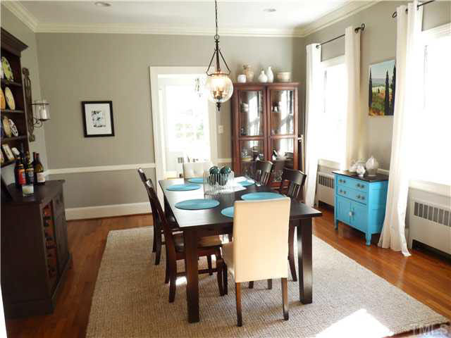 512 Chesterfield Road Raleigh, NC 27608 - Photo 6 of 25 a view of a dining room with furniture and wooden floor