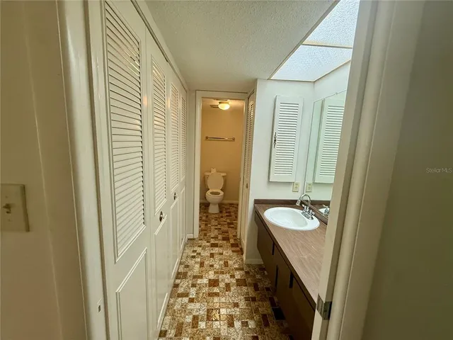 a view of hallway with wooden floor