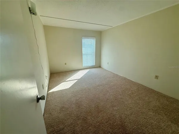 a view of swimming pool with outdoor seating and yard in back