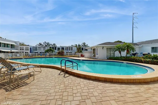 a view of a balcony with wooden floor and city view