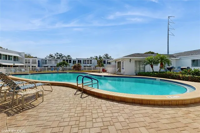 a view of a balcony with wooden floor and city view