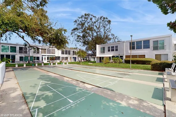 a view of parking garage with cars