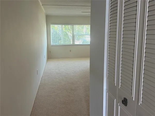 a view of an empty room and window