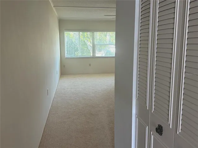 a view of an empty room and window