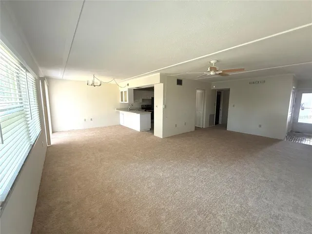a kitchen with stainless steel appliances a stove a sink and a refrigerator