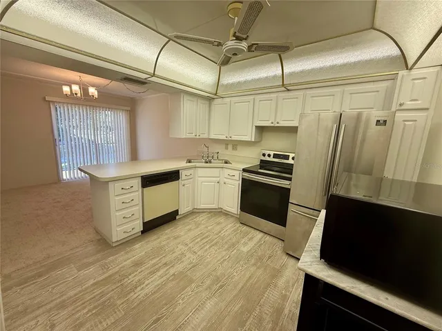 a view of a hallway with a wooden floor