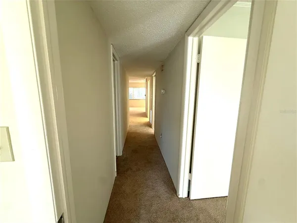 a view of a room with a wooden floor