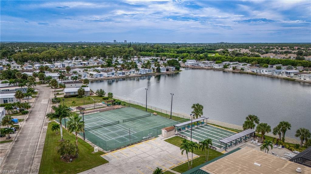 26 Bass Lane Naples, FL 34114 - Photo 14 of 26 Aerial view of residential area with a nearby body of water