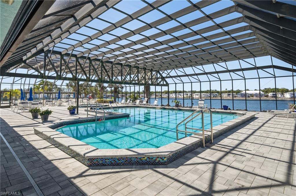 26 Bass Lane Naples, FL 34114 - Photo 17 of 26 Community pool with a patio