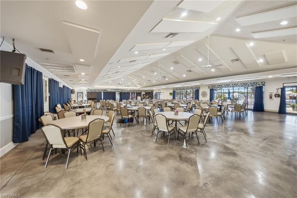 26 Bass Lane Naples, FL 34114 - Photo 25 of 26 Dining space featuring finished concrete floors, lofted ceiling, recessed lighting, and a ceiling fan