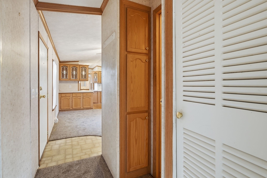 15 Quaboag Valley, Unit 15 Sudbury, MA 01776 - Photo 24 of 35 a view of a bathroom from the hallway
