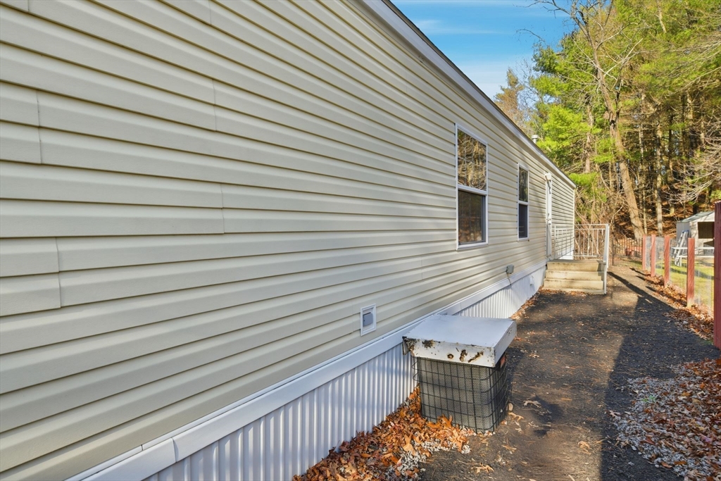 15 Quaboag Valley, Unit 15 Sudbury, MA 01776 - Photo 30 of 35 a view of a wooden balcony with chairs