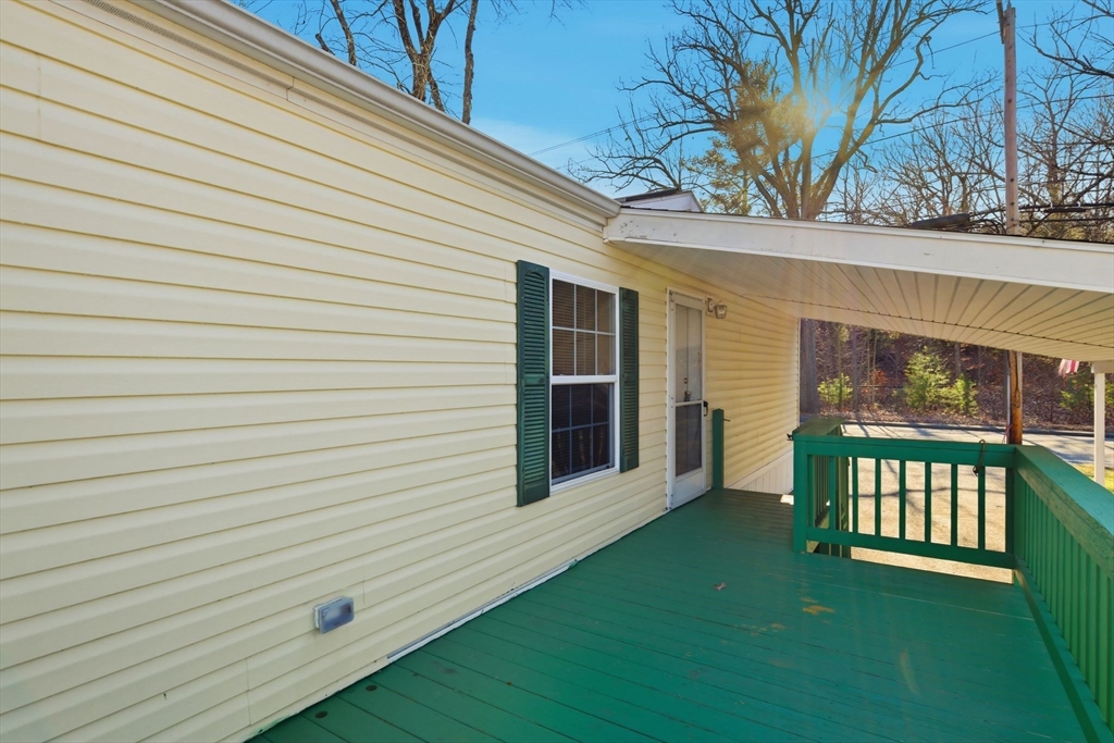 15 Quaboag Valley, Unit 15 Sudbury, MA 01776 - Photo 33 of 35 a view of a porch with a yard