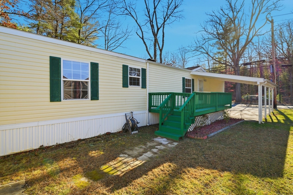 15 Quaboag Valley, Unit 15 Sudbury, MA 01776 - Photo 35 of 35 a view of a house with backyard and sitting area