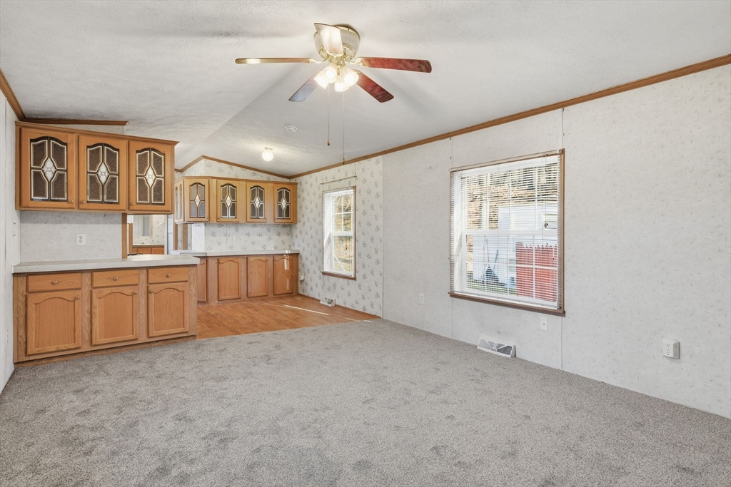15 Quaboag Valley, Unit 15 Sudbury, MA 01776 - Photo 7 of 35 a view of an empty room with a window