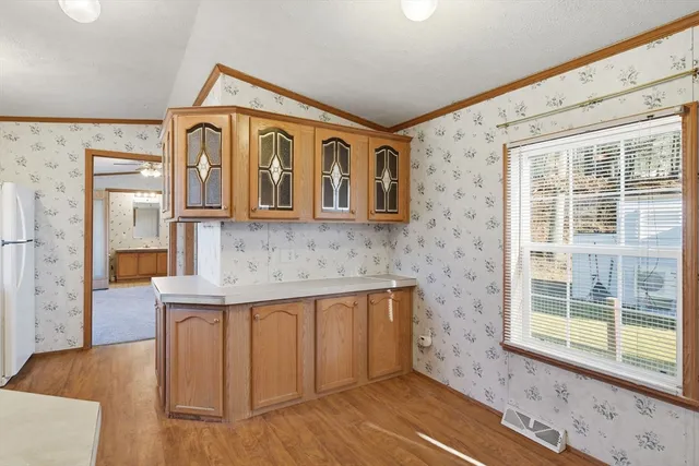 a view of a house with wooden floor and a sink