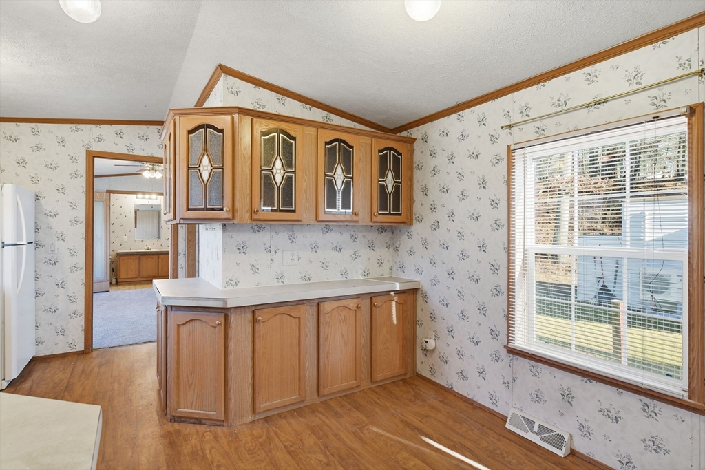 15 Quaboag Valley, Unit 15 Sudbury, MA 01776 - Photo 10 of 35 a view of a house with wooden floor and a sink