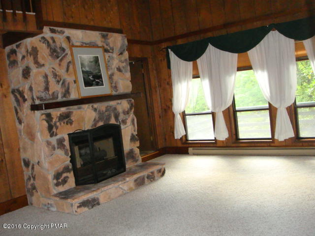 232 Regent Street Bushkill, PA 18324 - Photo 5 of 25 a view of a fireplace in a room