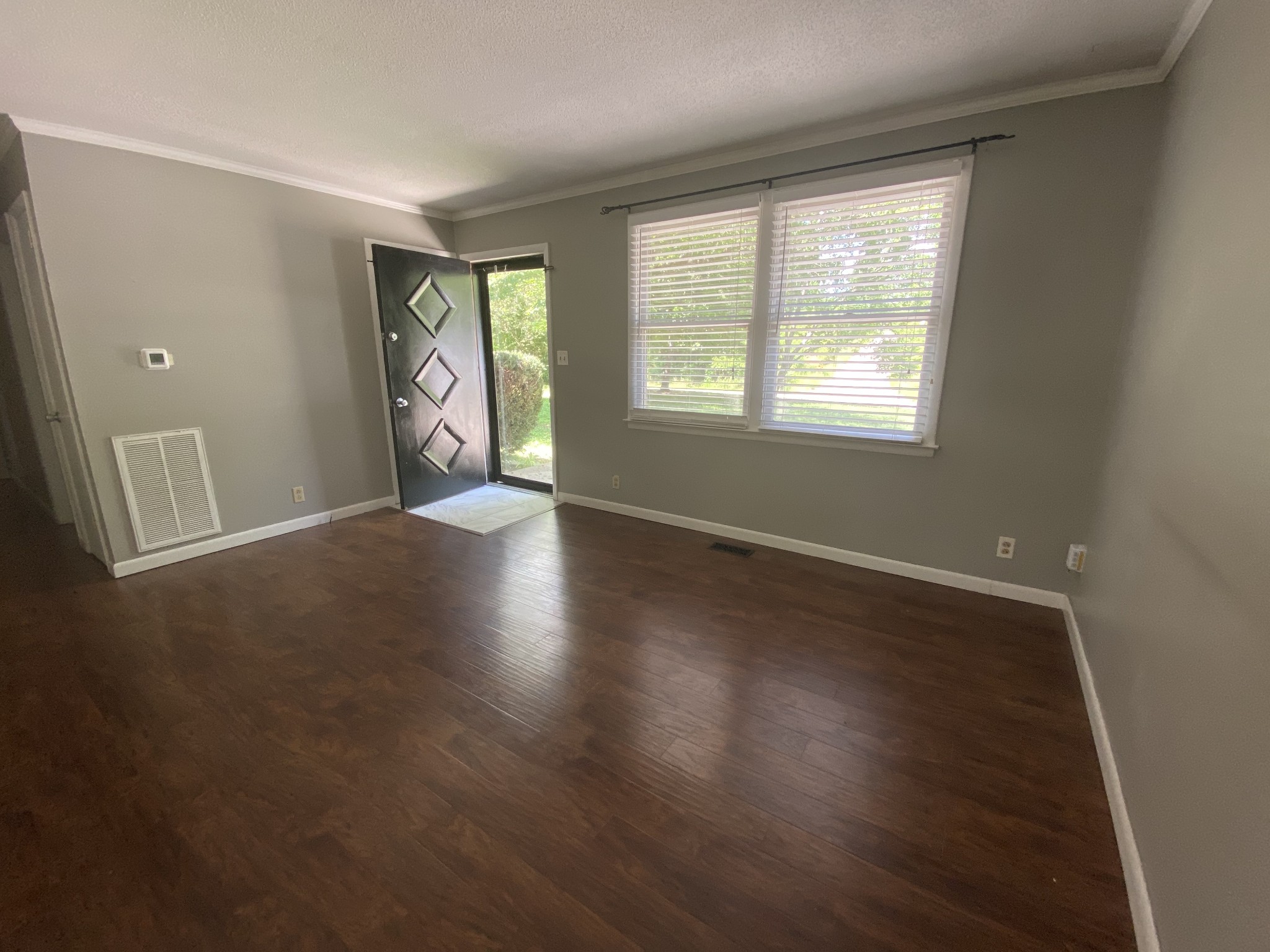 1320 Gratton Road Clarksville, TN 37043 - Photo 9 of 14 an empty room with wooden floor and windows