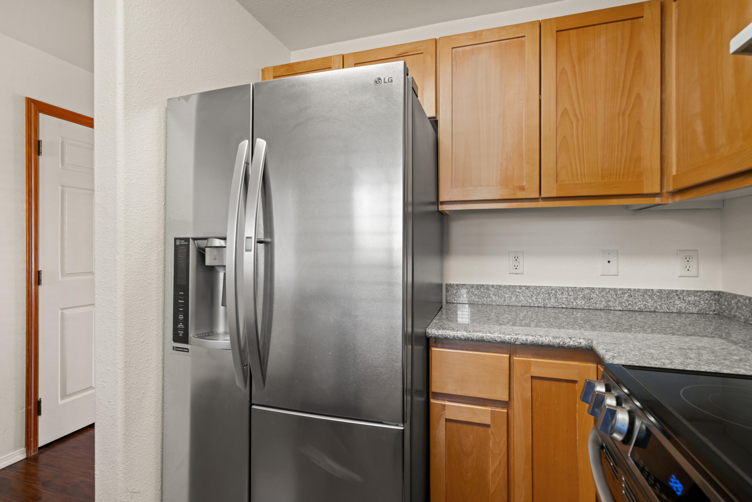 450 Midway Road, Unit 33 Medford, OR 97501 - Photo 11 of 21 a kitchen with stainless steel appliances granite countertop a refrigerator and a sink