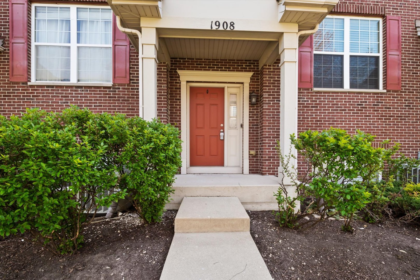 1908 Oxley Circle Naperville, IL 60563 - Photo 1 of 27 a front view of a house with a yard