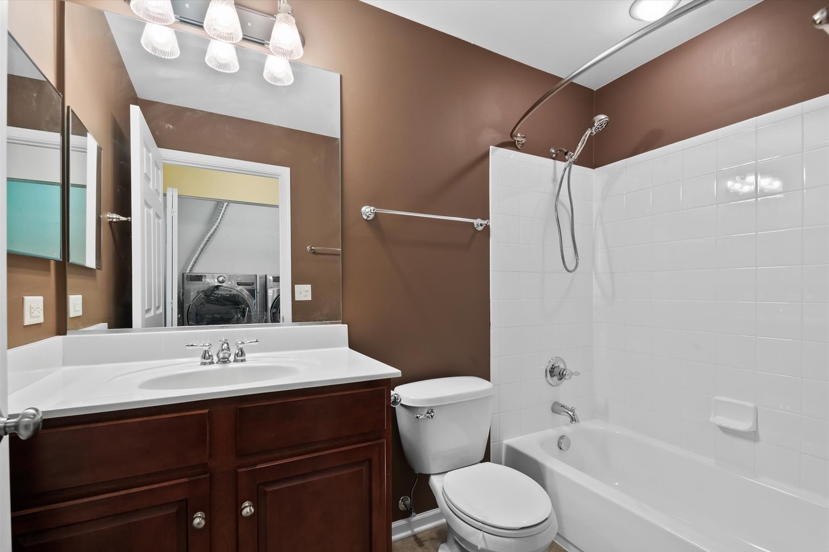 1908 Oxley Circle Naperville, IL 60563 - Photo 20 of 27 a bathroom with a sink a toilet a mirror and shower