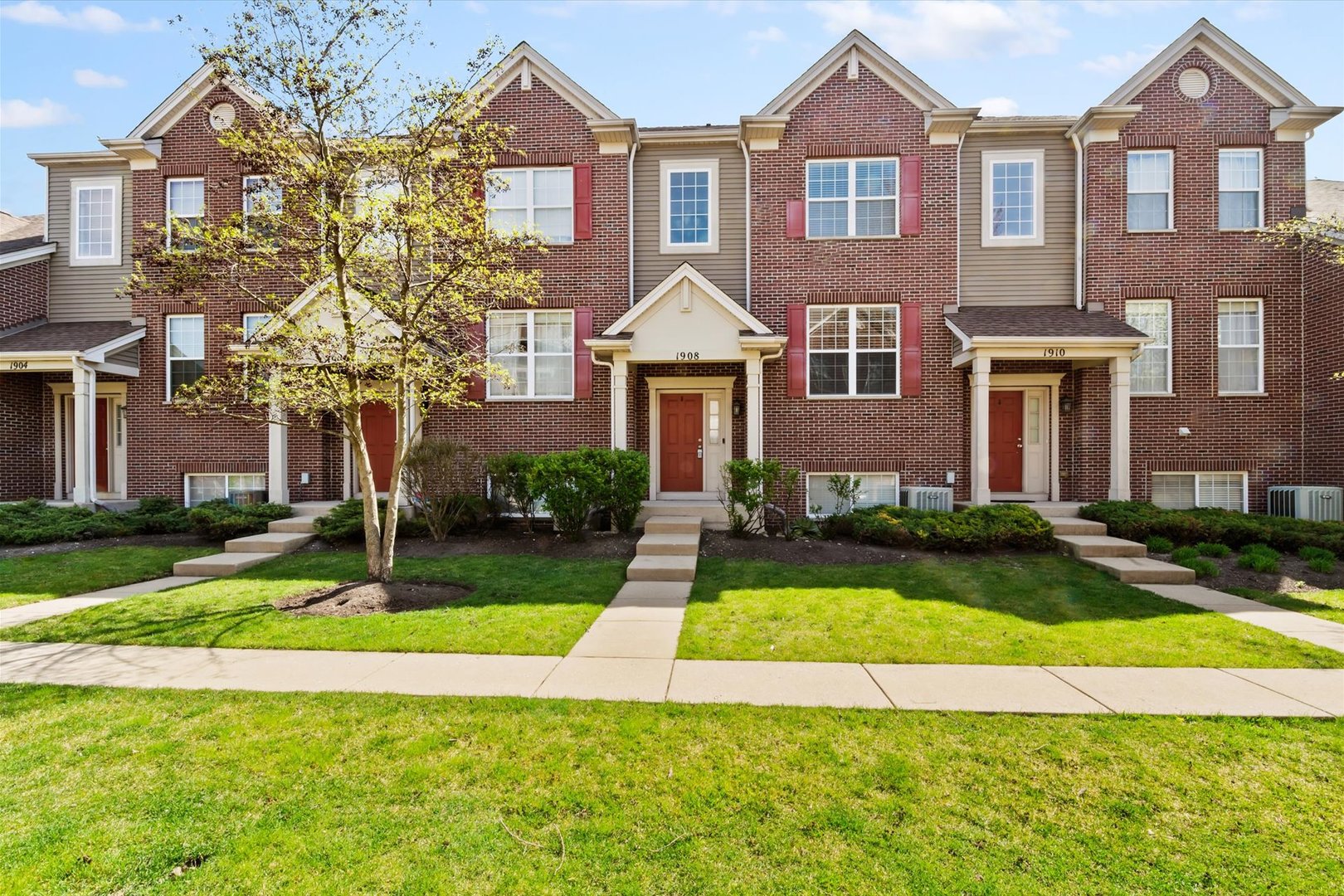 1908 Oxley Circle Naperville, IL 60563 - Photo 27 of 27 a front view of a residential houses with yard and green space