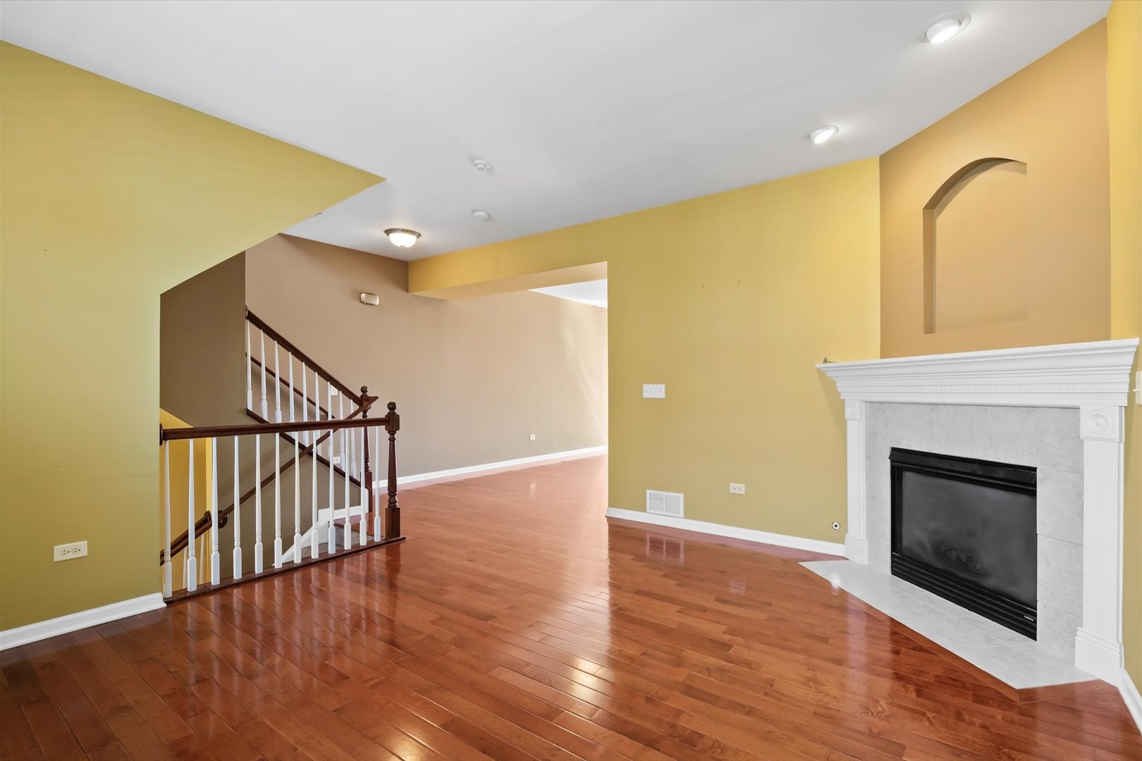 1908 Oxley Circle Naperville, IL 60563 - Photo 5 of 27 a view of an empty room with wooden floor and a fireplace