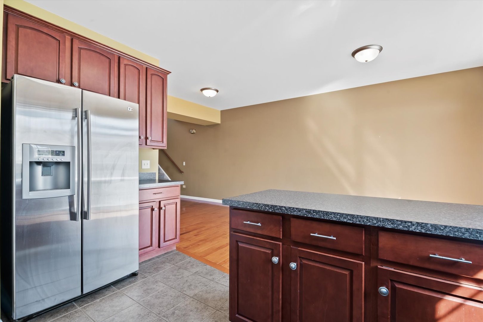 1908 Oxley Circle Naperville, IL 60563 - Photo 10 of 27 a kitchen with stainless steel appliances granite countertop a refrigerator and a sink