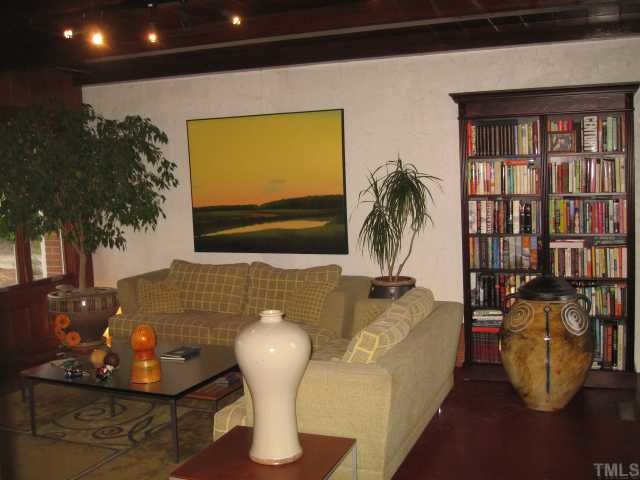 209 Lord Berkley Road Raleigh, NC 27610 - Photo 5 of 12 a living room with furniture and a potted plant