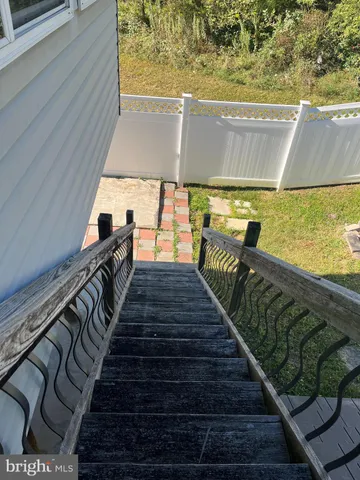a view of swimming pool with wooden floor