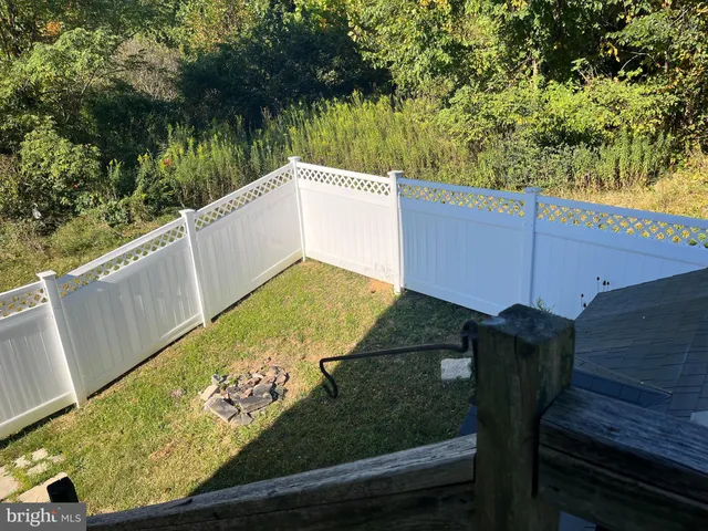 a view of a two chairs next to a yard