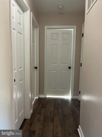 a view of a bathroom with wooden floor