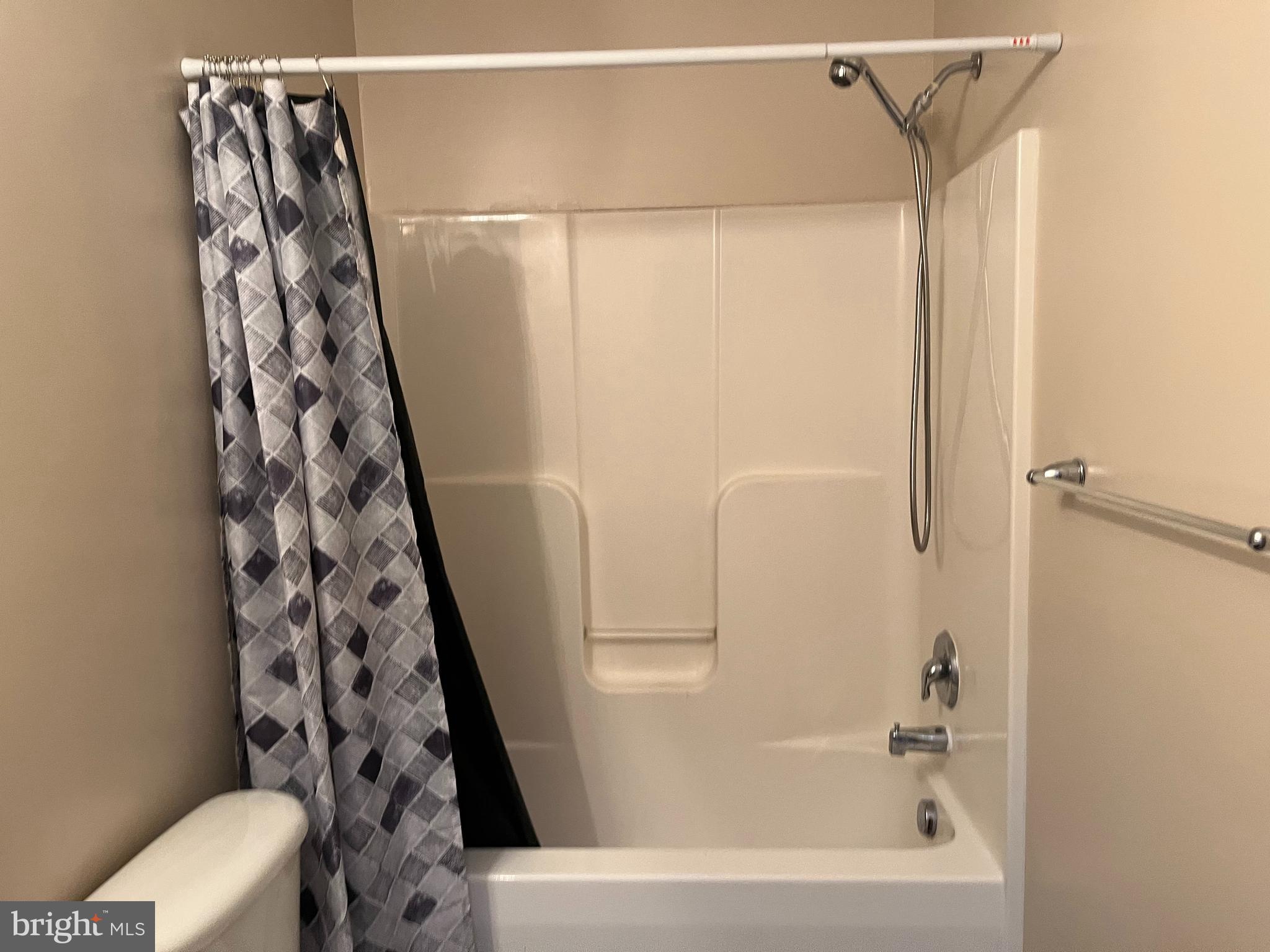 199 Rumbling Rock Road Hedgesville, WV 25427 - Photo 21 of 44 a bathroom with a bathtub and a shower