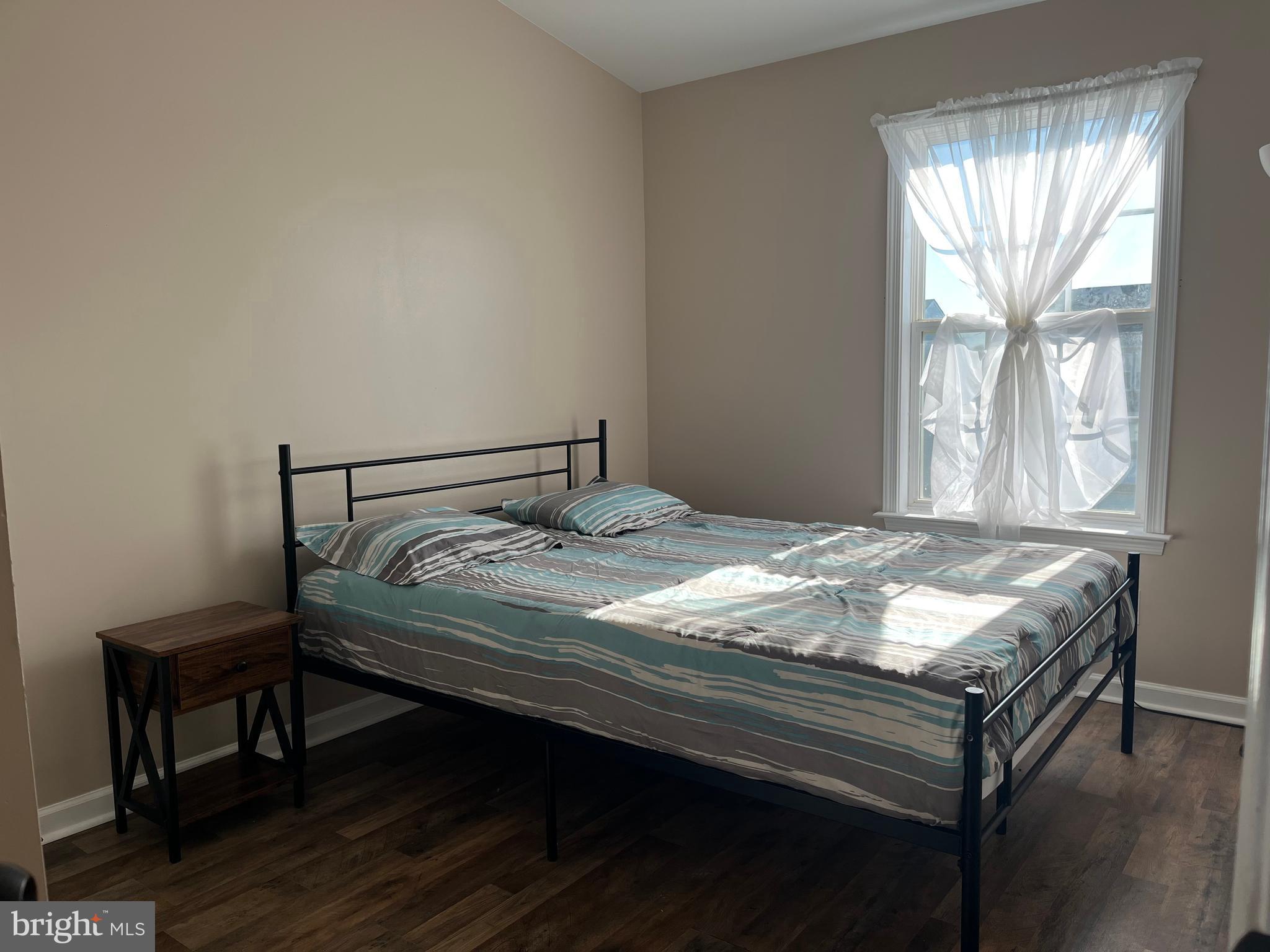 199 Rumbling Rock Road Hedgesville, WV 25427 - Photo 23 of 44 a bedroom with a bed and window