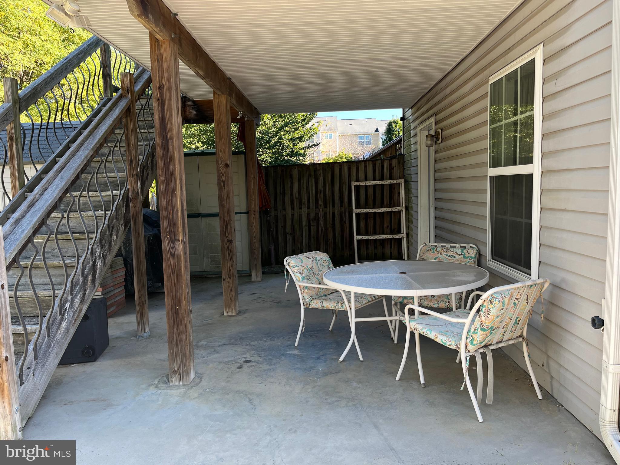 199 Rumbling Rock Road Hedgesville, WV 25427 - Photo 35 of 44 a patio with table and chairs