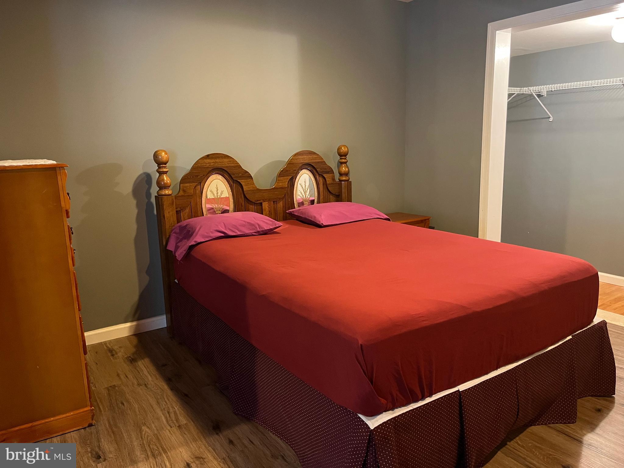 199 Rumbling Rock Road Hedgesville, WV 25427 - Photo 40 of 44 a large bed sitting in a bedroom next to a window