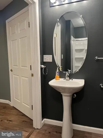 a bathroom with a sink and mirror